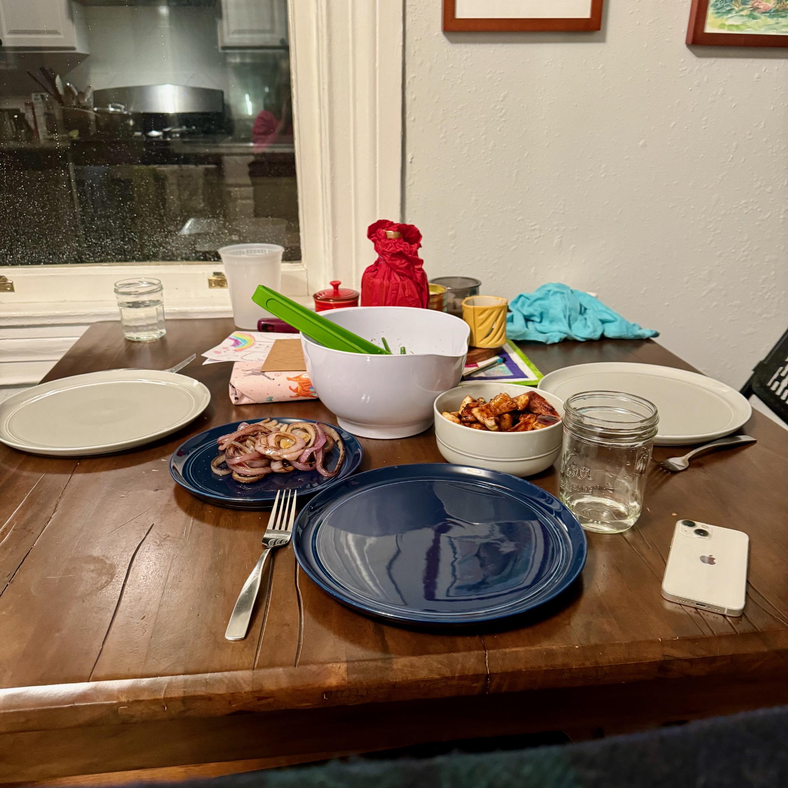 A table arrayed with a variety of bowls and plates.