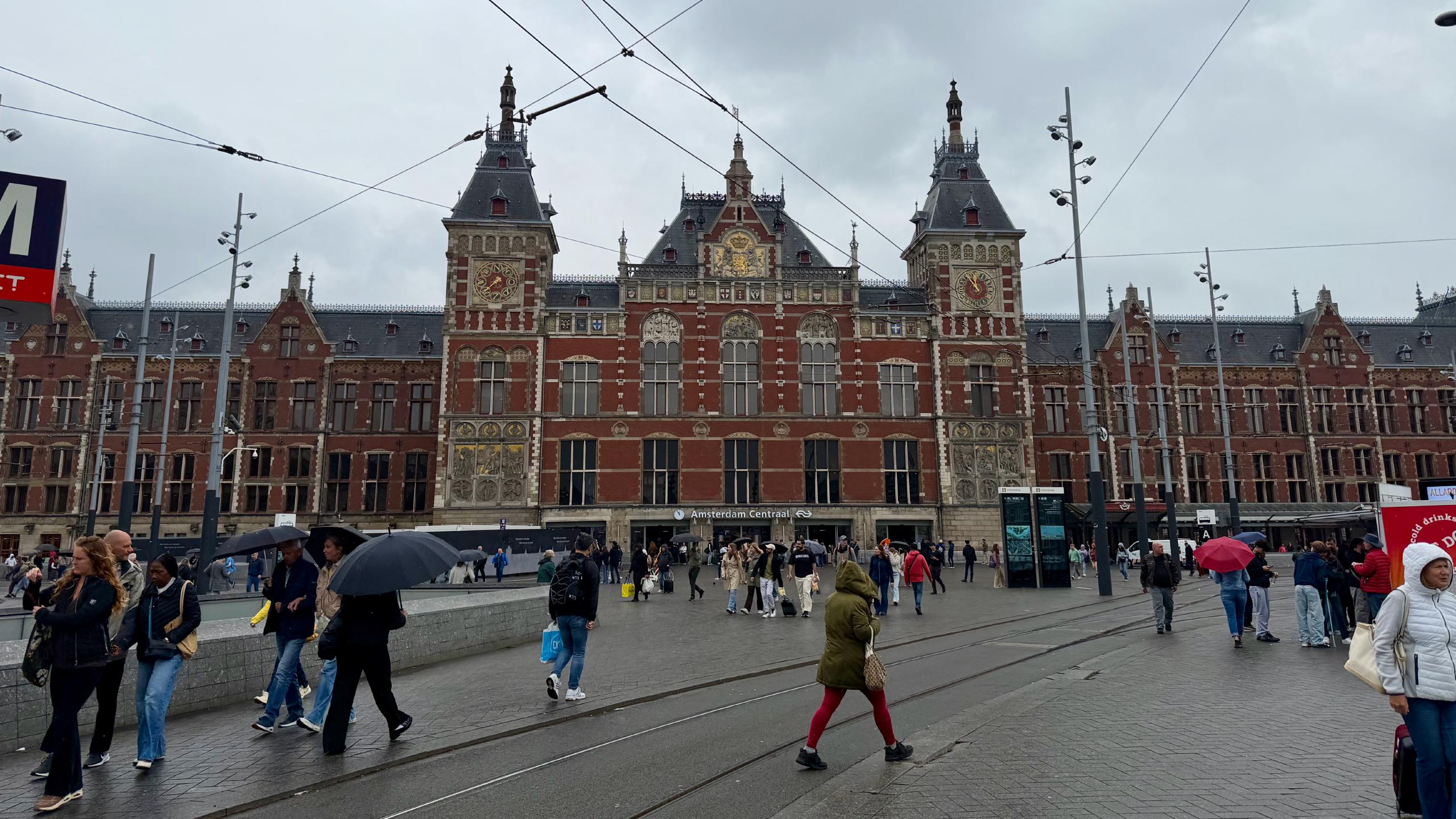 Amsterdam Centraal is a busy train station, surrounded by busy tram stops. Lots
of people coming and going.
