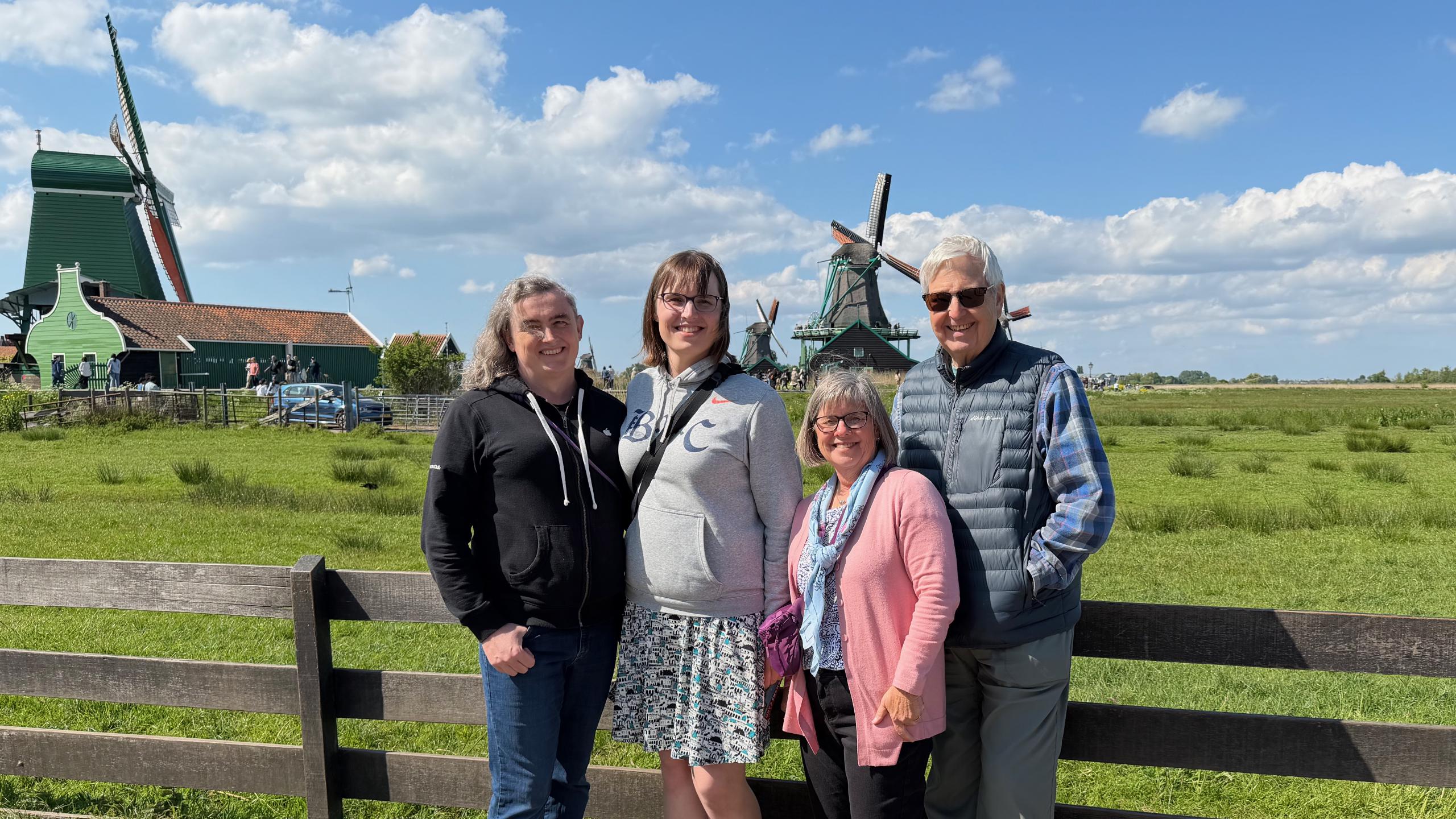Tess, me, mom, and dad in front of the windmills at Zaanse Schans.
